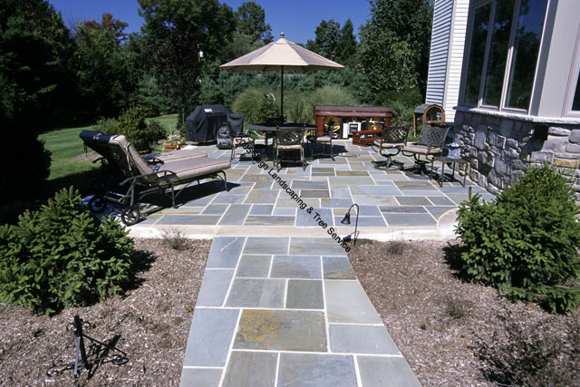 bluestone patio with outdoor kitchen